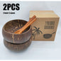 coconut bowls with wooden spoons -- Coconut shell bowls, suitable for serving yogurt, salad, or ice cream.